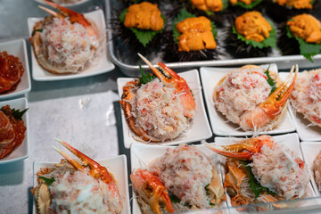 thai food coFresh red crab meat with muscles that prepared in dish for sale at fish market. Food and object, close-up with selective focus.