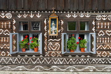 Old wooden house with geometric pattern detail view, Cicmany, Slovakia