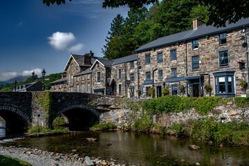 Stone Bridge And River In The City Of Beddgelert In Snowdonia National Park In Gwynedd, Wales, United Kingdom
