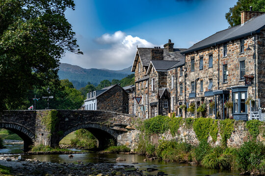 Stone Bridge And River In The City Of Beddgelert In Snowdonia National Park In Gwynedd, Wales, United Kingdom