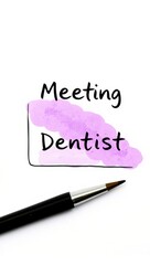 Reminder note for dentist appointment with ink pen on paper  