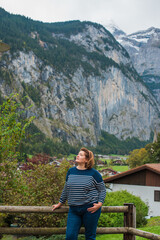 Naklejka premium Mature Woman in Europe. Autumn Lifestyle Concept. Stylish plus size lady dressed in warm fall clothing, casual outfit. Lifestyle and travel concept showing body positivity, self confidence
