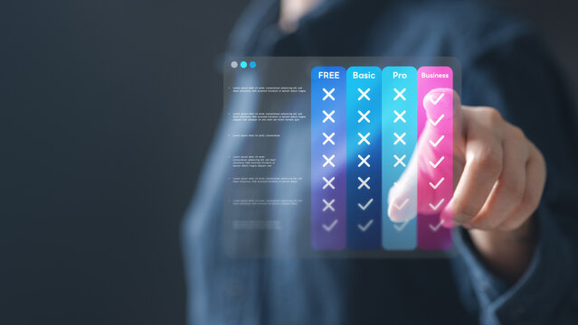 pricing, table, compare, plans, monthly, Business hand selecting digital pricing table with plan comparison, showing free, basic, pro, and business tiers for online service or subscription management.