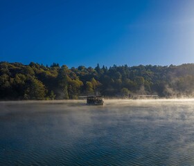 A boat on the misty Lake Kozjak