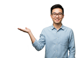 Young asian man wearing glasses offers a product with a friendly smile and open hand transparent background
