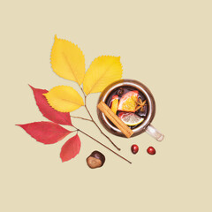 Cup Of Mulled Wine With Autumn Leaves, Chestnut And Berries On Beige Background. Concept Of Fall Cozy Drinks, Autumn Seasonal Beverages, Thanksgiving Mood, Warming Recipes, And Autumn Food Visuals