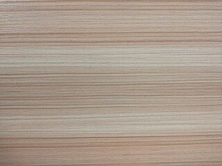 Naklejka premium A close-up Light horizontal wood grain texture background 