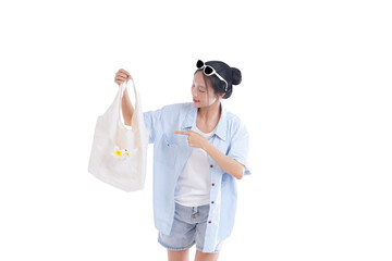 Style in Simplicity: A young person, exuding a blend of style and functionality, presents a canvas tote bag. Embracing a relaxed summer vibe, the image speaks of simplicity.