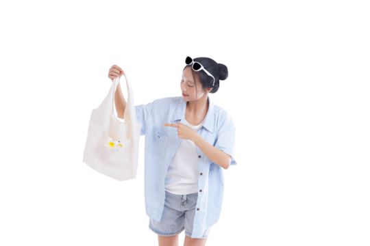 Style in Simplicity: A young person, exuding a blend of style and functionality, presents a canvas tote bag. Embracing a relaxed summer vibe, the image speaks of simplicity.