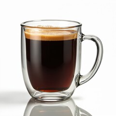 Naklejka premium Clear double wall glass mug contains fresh dark coffee. Rich brown crema tops hot espresso. Morning drink sits on simple white studio background. Ready to enjoy daily for energy, warmth, perfect