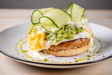 Avocado toast with scrambled eggs and yogurt sauce