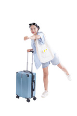 Travel Ready: A young woman, radiating a sense of excitement, pauses with her suitcase, ready to...