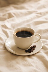 Morning coffee cup on soft sheets