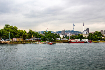 Fototapeta premium Scenic view of the Bosphorus Strait with Istanbul city skyline, spiral tower, and historic mosque minaret