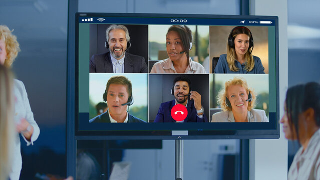 Global diverse business team participating in a corporate video call meeting, communicating and collaborating effectively while working from various locations using modern technology