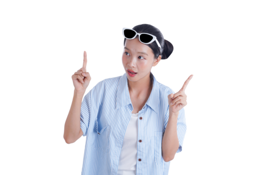 Look at This! A curious young woman gestures upwards with both hands, her attention captured by something intriguing, showcasing youthful expression and captivating charm.