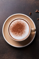 Cappuccino with frothy top and cocoa powder encouraging educational understanding of coffee traditions and fostering appreciation for cultural diversity
