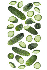 Bright green bumpy cucumber - whole, slices fly or fall as straight flow, stripe isolated on white background. Wholesome and vitamin ingredient for salads, healthy dietary menus, advertising, design.