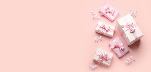 Gift boxes on pink background with space for text, top view