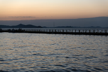 Fototapeta premium pier on the sea after sunset