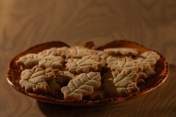 Homemade Autumn Leaf Cookies on an Orange Pumpkin Plate