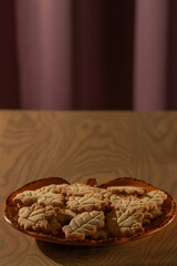 Homemade Autumn Leaf Cookies on an Orange Pumpkin Plate