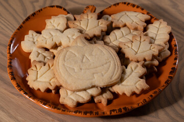 Homemade Halloween Jack-O'-Lantern and Leaf Cookies on a Plate