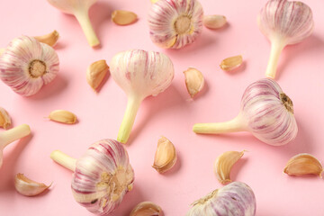 Fresh garlic on pink background