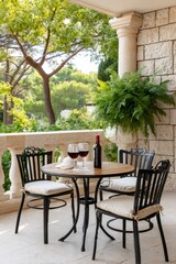 Fototapeta premium Balcony terrace offering red wine, preparing for a relaxing romantic evening