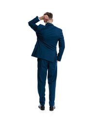 confused young man in navy blue suit scratching head and thinking