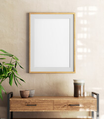 Vertical Wooden Picture Frame Hanging on the Wall, sideboard table, plant and ceramic vase.