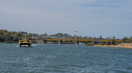 Residential Houses and apartment buildings on Parramatta River Sydney Harbour on a warm spring cloudy overcast day in Sydney NSW Australia 