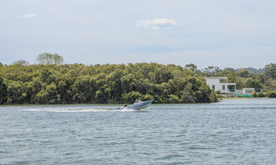 Residential Houses and apartment buildings on Parramatta River Sydney Harbour on a warm spring cloudy overcast day in Sydney NSW Australia 
