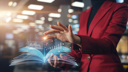 Woman in red jacket interacts with glowing digital book displaying charts and graphs interactive technology