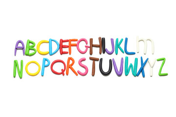 English alphabet made of color play dough on white background
