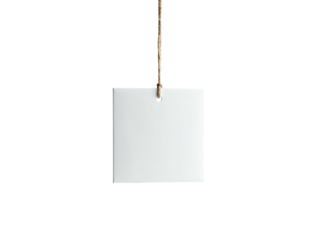 A white square card hangs from a string against a stark black background, minimalist presentation