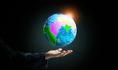 A glowing digital globe above a businessman hand represents regionalism, economic integration,...