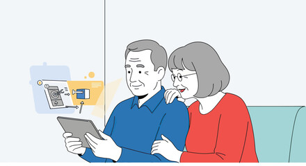Smiling senior couple, grey hair, man in blue, woman in red, using tablet, interacting with digital interface.