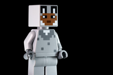 Naklejka premium LEGO Minecraft character with rabbit face mask standing sideways on the black background