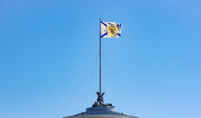 Official Russian Navy’s flag. the Russian Navy’s Andreevsky Flag flying atop of a building in Saint Petersburg, Russia. For travel brochures, historical articles, or cultural presentations