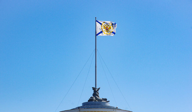 Official Russian Navy&rsquo;s flag. the Russian Navy&rsquo;s Andreevsky Flag flying atop of a building in Saint Petersburg, Russia. For travel brochures, historical articles, or cultural presentations