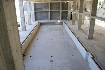 old abandoned building. preparation for construction work. poured concrete hole