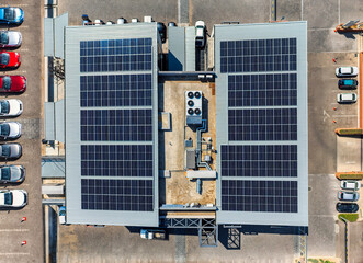 solar panels on roof of a building, aerial view top down air-conditioning unit industrial on the roof of a building © poco_bw