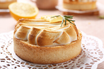 Tasty lemon tartlet on table, closeup