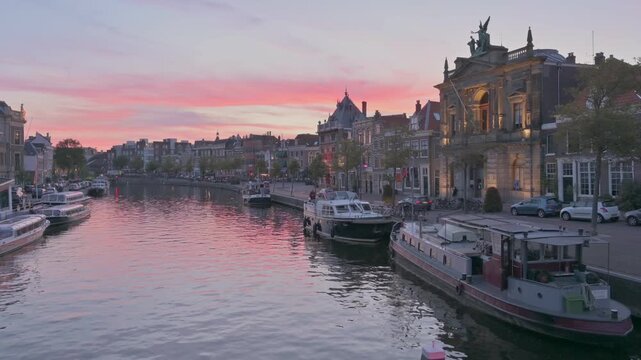 Spaarne River with Old Canal Houses in Haarlem at Sunset, Netherlands