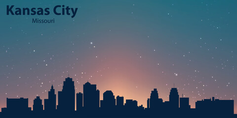 Silhouette of Kansas City, Missouri, against an evening sky with a gradient from pink to blue. Stars are visible in the sky, and below are the outlines of buildings forming the city skyline.