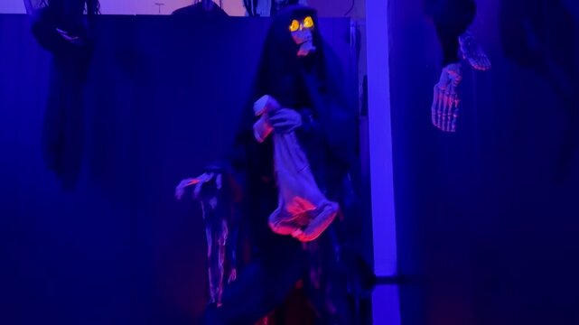 Halloween ghosts display in a haunted house.