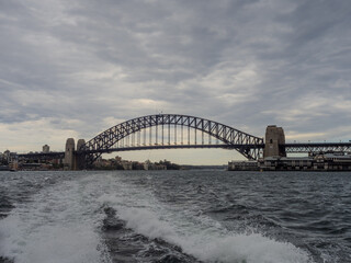 Obraz premium 11 October 2025 Sydney Harbour Bridge at Circular Quay on Sydney Harbour on a cloudy cool spring Day in Sydney NSW Australia