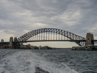 Obraz premium 11 October 2025 Sydney Harbour Bridge at Circular Quay on Sydney Harbour on a cloudy cool spring Day in Sydney NSW Australia