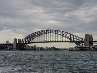 11 October 2025 Sydney Harbour Bridge at Circular Quay on Sydney Harbour on a cloudy cool spring Day in Sydney NSW Australia